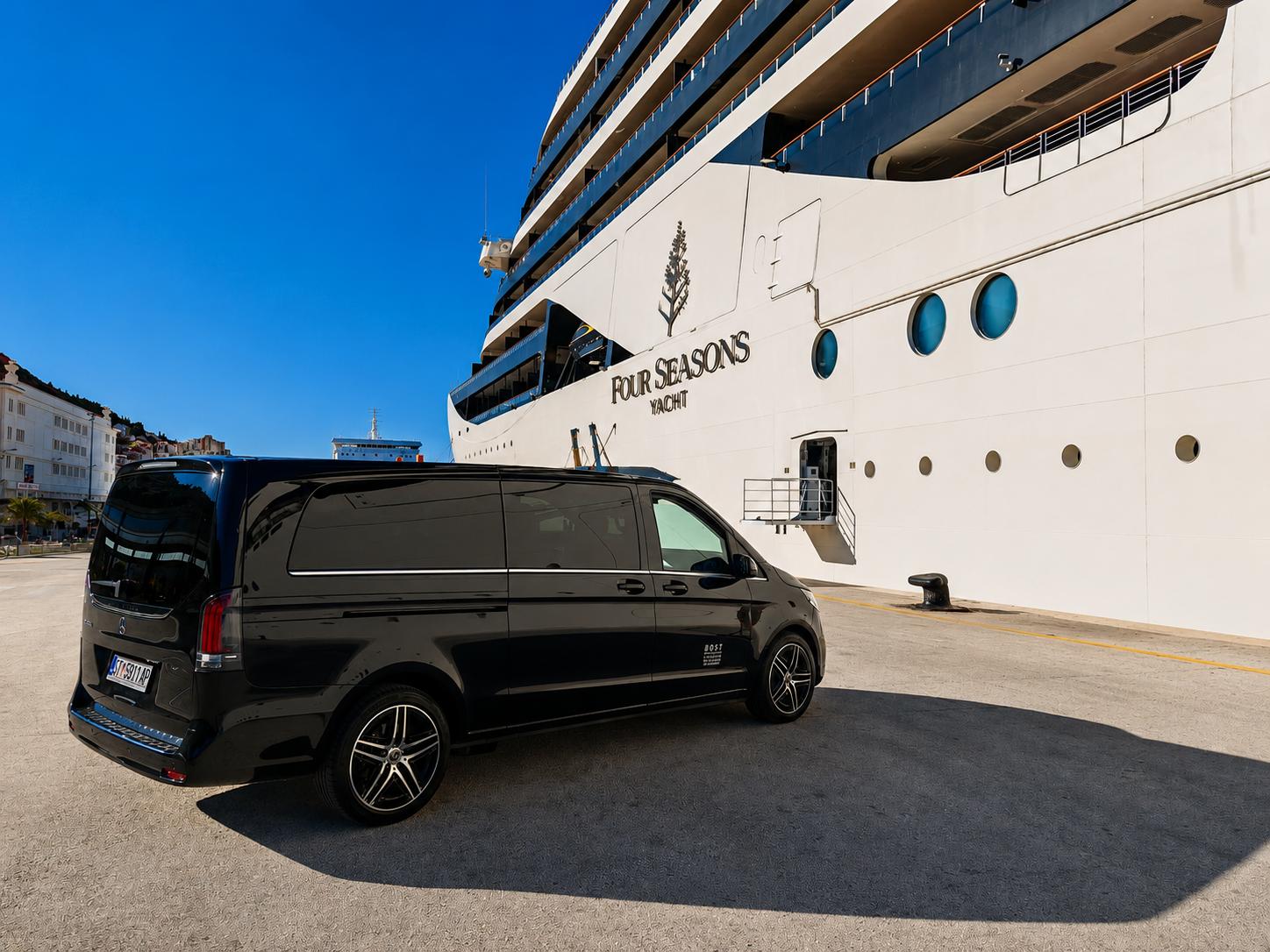 Mercedes-Benz V-Class cruise transfer vehicle waiting beside a Four Seasons luxury yacht at the port of Split