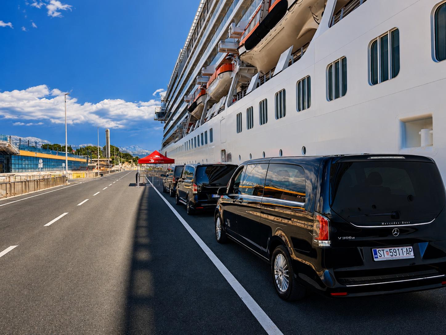 Line of black Mercedes-Benz V-Class cruise transfer vehicles waiting alongside a cruise ship at the port of Split
